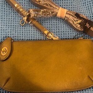 Joy Susan Olive Wristlet Clutch come with wristlet straps and long straps.